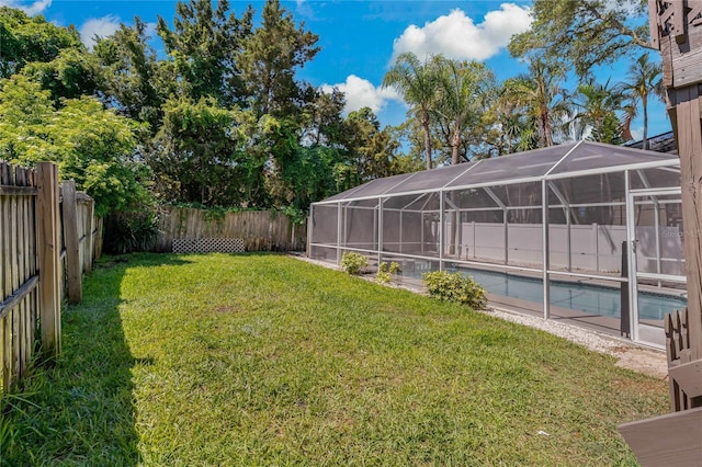 view of yard with a lanai