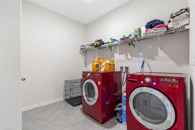 clothes washing area featuring independent washer and dryer