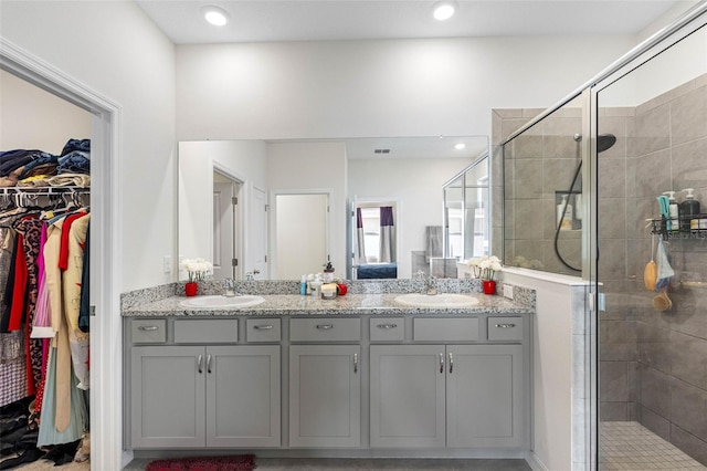 bathroom with vanity and an enclosed shower