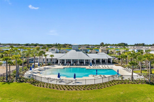 view of pool featuring a yard and a patio