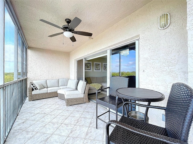 sunroom with ceiling fan and a healthy amount of sunlight