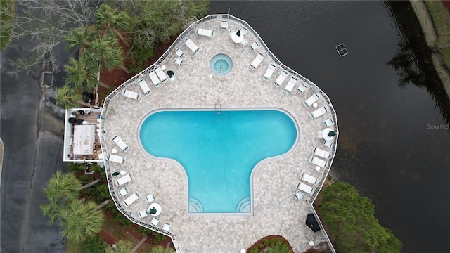 view of swimming pool with a water view