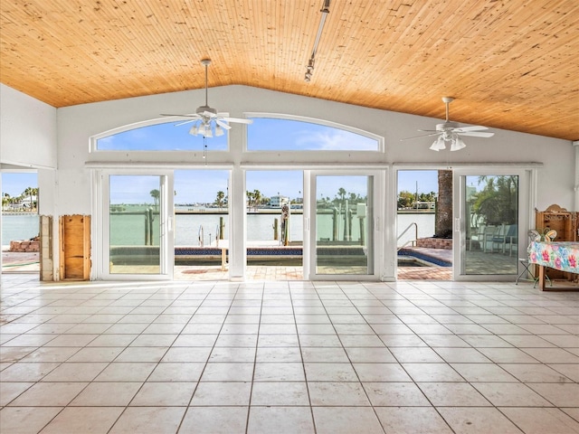 unfurnished sunroom featuring a water view, wooden ceiling, and vaulted ceiling