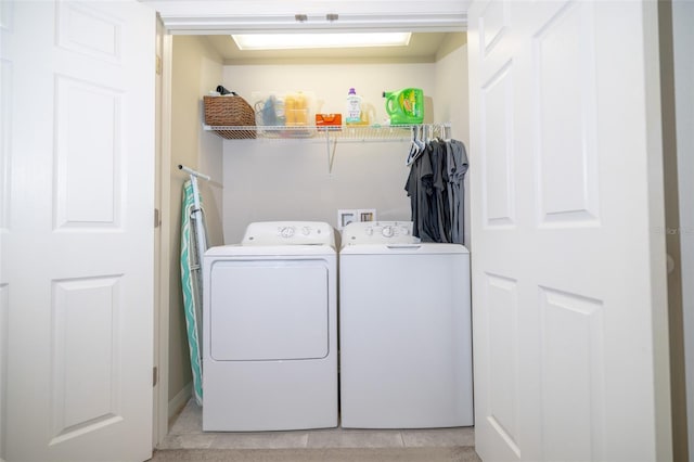 washroom with washer and dryer