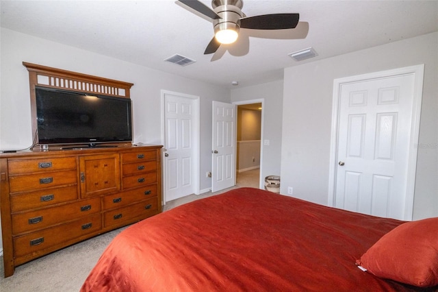 bedroom with ceiling fan and light colored carpet