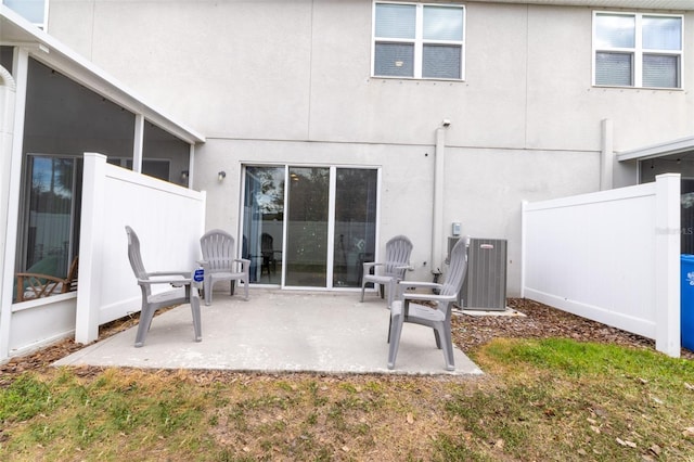 back of property featuring a patio area and central air condition unit