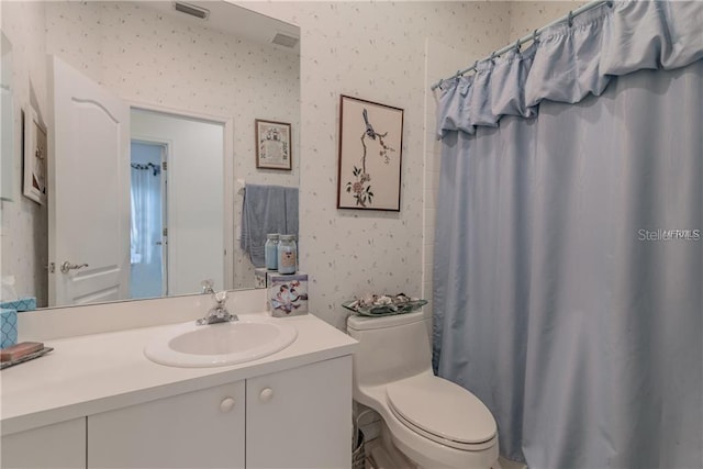 bathroom with vanity and toilet