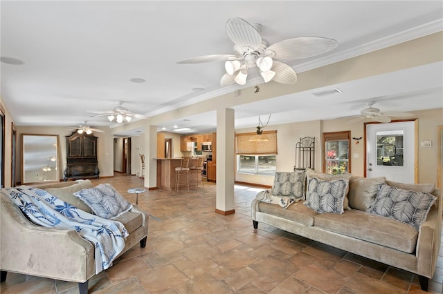 living room featuring ceiling fan and ornamental molding