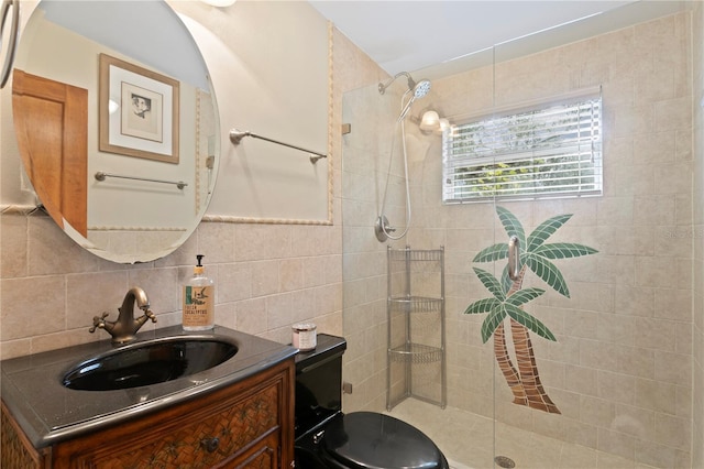 bathroom featuring tasteful backsplash, tile walls, vanity, tiled shower, and toilet