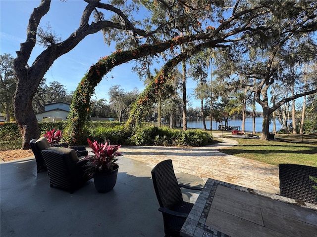 view of patio featuring a water view