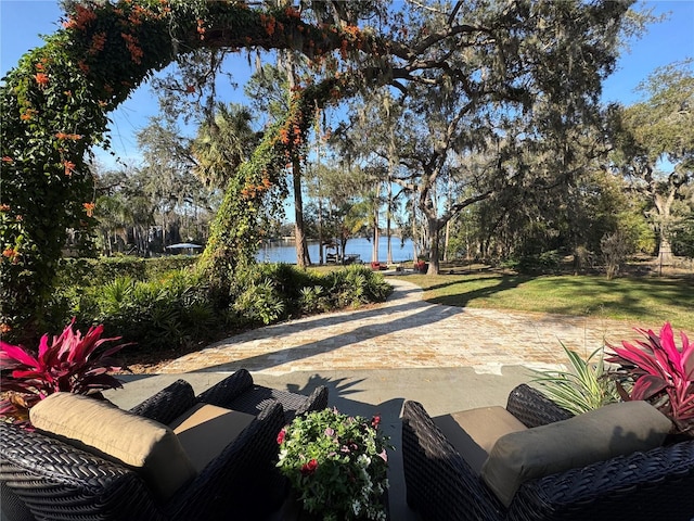 view of patio with a water view