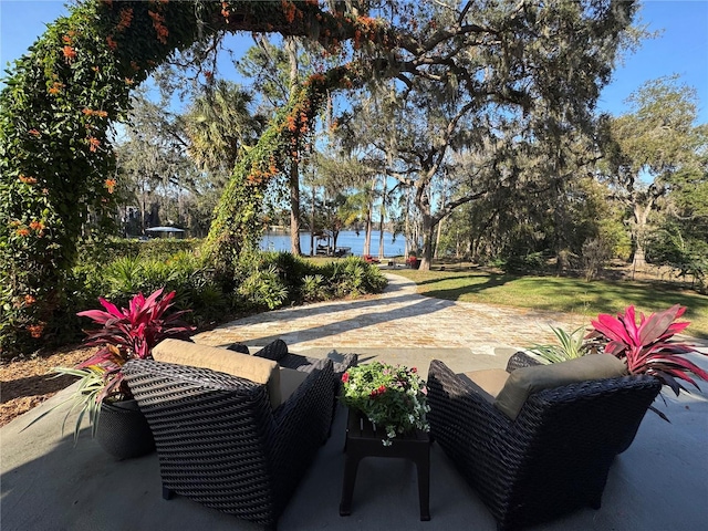 view of patio with a water view