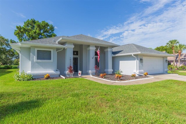 10328 Henderson St, Spring Hill, FL 34608 - view of front of property featuring a garage and a front yard