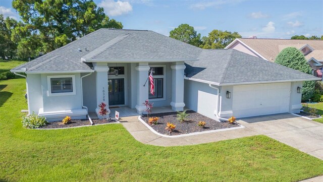 10328 Henderson St, Spring Hill, FL 34608 - single story home with a front lawn and a garage