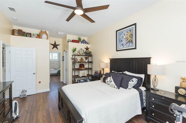 10328 Henderson St, Spring Hill, FL 34608 - bedroom with ensuite bath, ceiling fan, and dark hardwood / wood-style floors