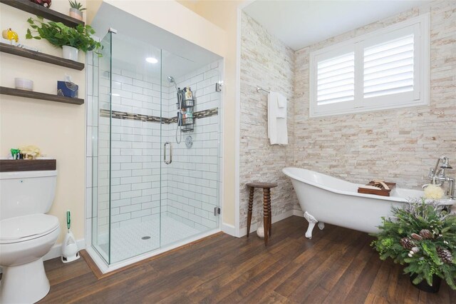 10328 Henderson St, Spring Hill, FL 34608 - bathroom featuring plus walk in shower, hardwood / wood-style flooring, and toilet