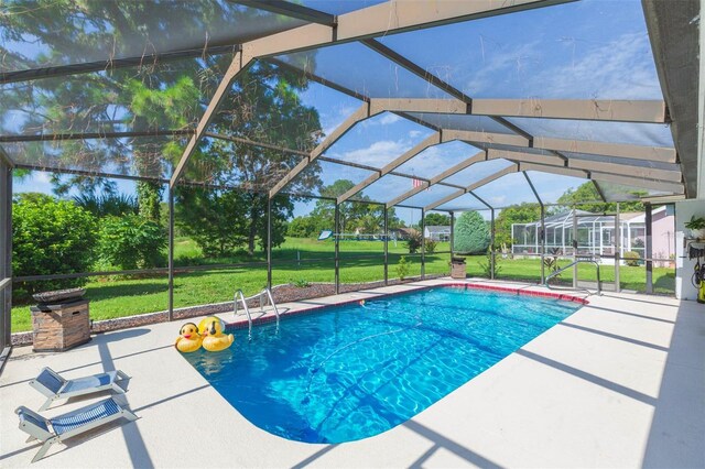 10328 Henderson St, Spring Hill, FL 34608 - view of swimming pool with a lanai, a yard, and a patio