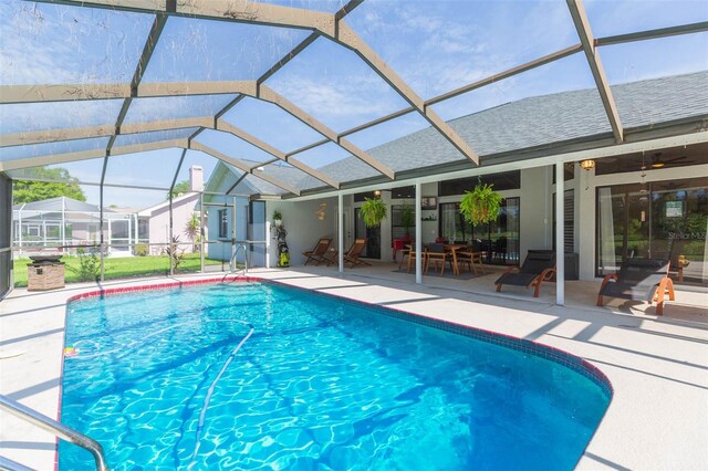 10328 Henderson St, Spring Hill, FL 34608 - view of pool featuring ceiling fan, a lanai, and a patio