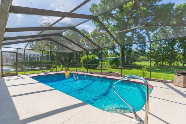 10328 Henderson St, Spring Hill, FL 34608 - view of swimming pool with a lanai, a patio area, and a yard