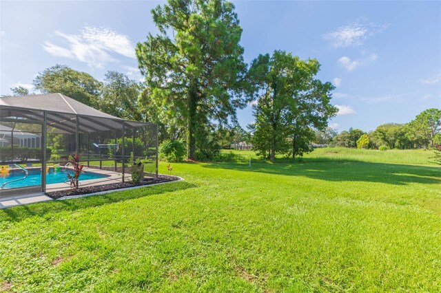 10328 Henderson St, Spring Hill, FL 34608 - view of yard with a lanai