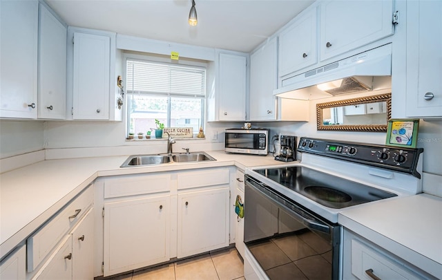 kitchen featuring white range with electric stovetop, sink, white cabinets, and light tile patterned floors