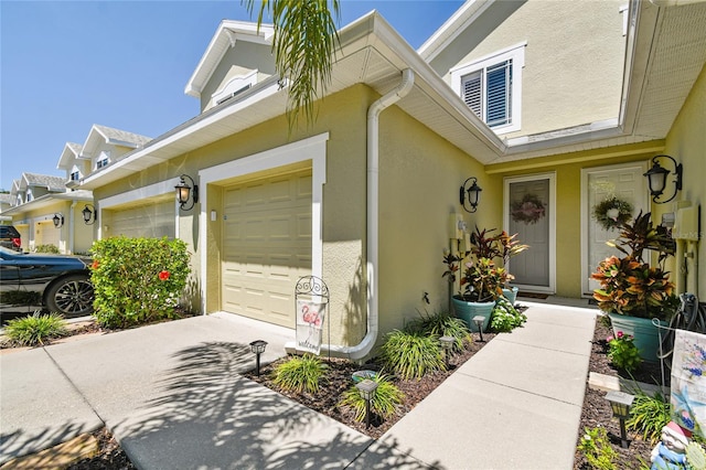 view of exterior entry with a garage