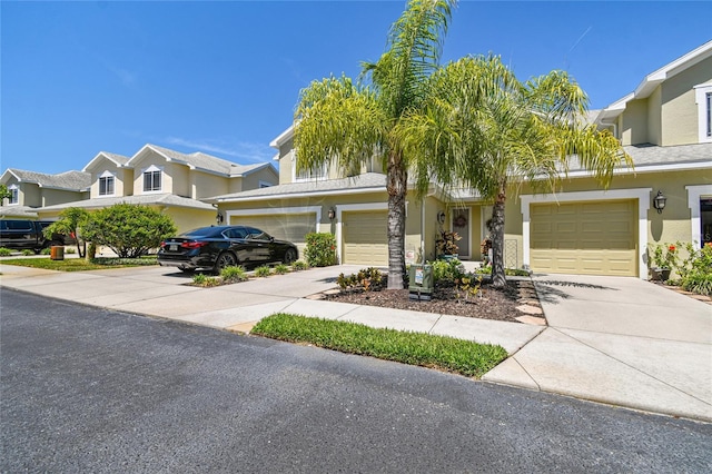 townhome / multi-family property featuring a garage