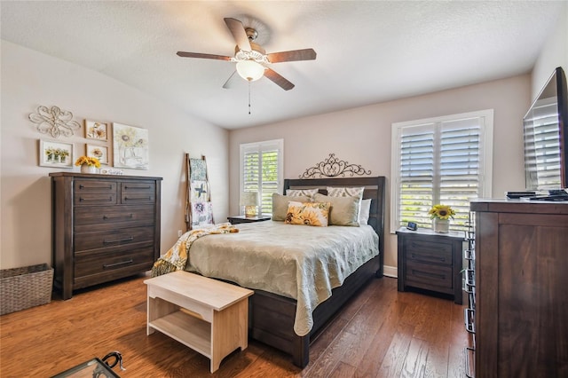 bedroom featuring a textured ceiling, dark hardwood / wood-style flooring, and ceiling fan