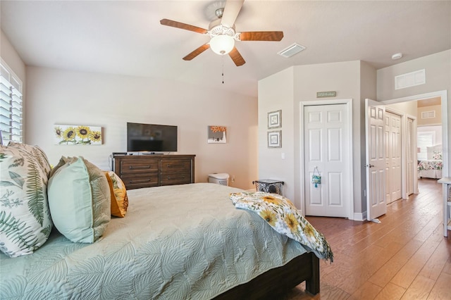 bedroom with hardwood / wood-style flooring and ceiling fan