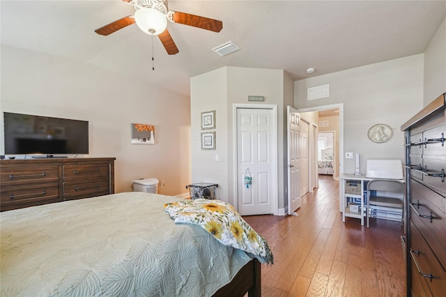 bedroom featuring a closet, ceiling fan, and dark wood-type flooring