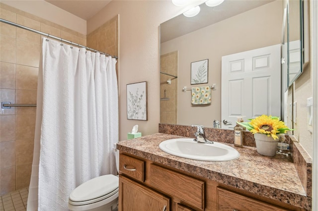 bathroom featuring vanity, toilet, and walk in shower