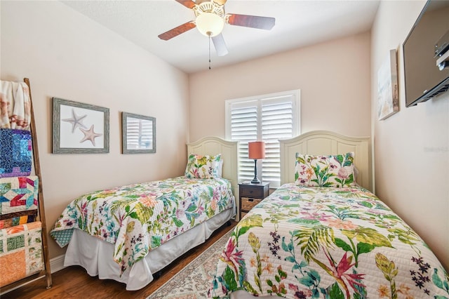 bedroom featuring ceiling fan and dark hardwood / wood-style flooring