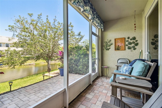 sunroom with a water view