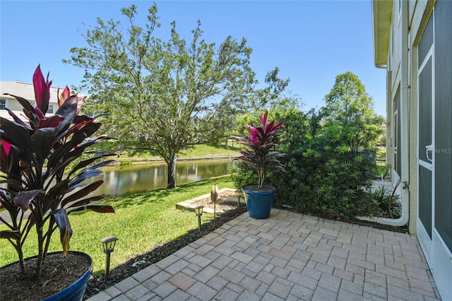 view of patio featuring a water view