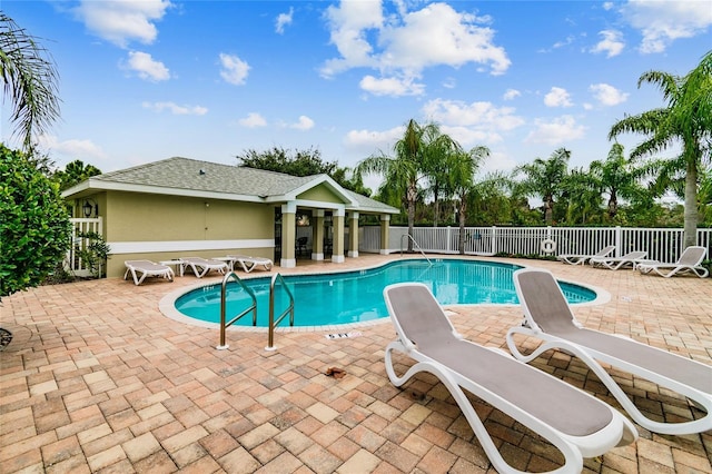 view of swimming pool with a patio