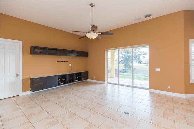 unfurnished living room featuring ceiling fan and light tile patterned floors