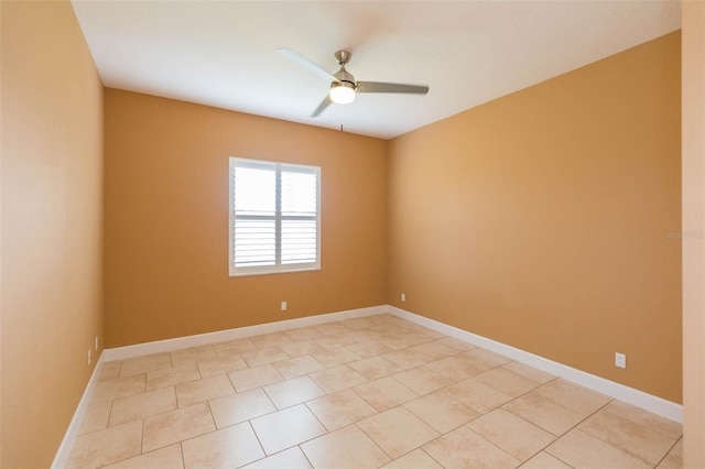 unfurnished room with ceiling fan and light tile patterned floors