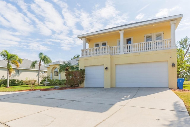 view of front of house featuring a balcony and a garage