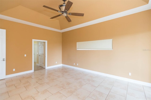 spare room featuring light tile patterned floors, a raised ceiling, ceiling fan, and ornamental molding