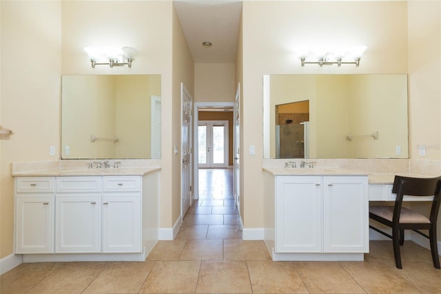 bathroom featuring french doors, tile patterned flooring, vanity, and an enclosed shower