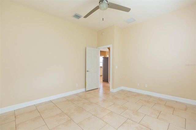 unfurnished room featuring ceiling fan and light tile patterned flooring