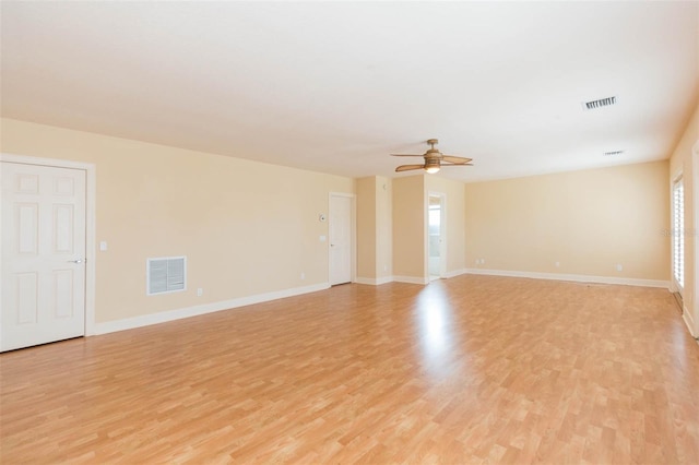 spare room featuring light hardwood / wood-style floors and ceiling fan