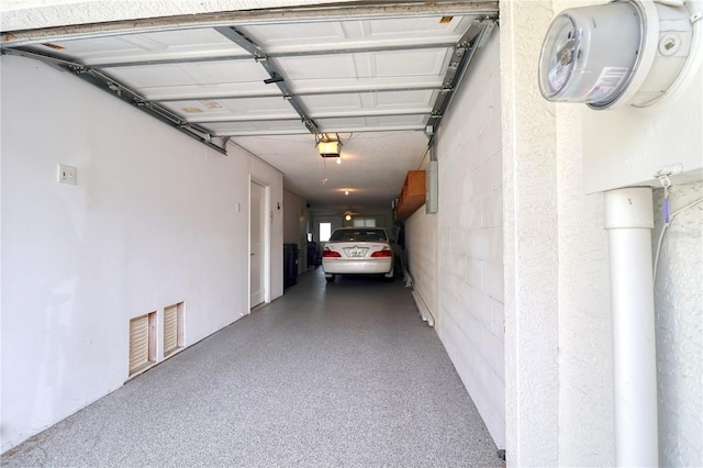 garage featuring a garage door opener