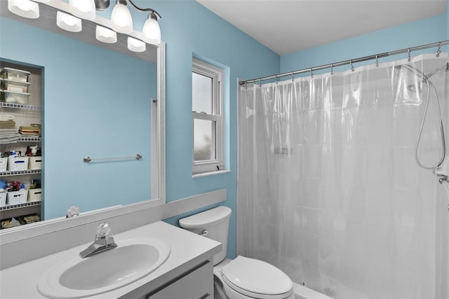 bathroom with vanity, toilet, and a shower with shower curtain