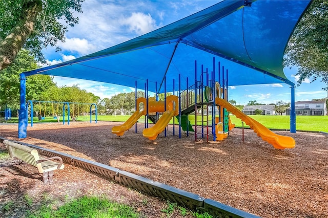 view of jungle gym with a lawn