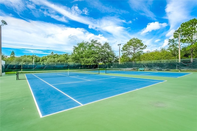 view of sport court with basketball hoop