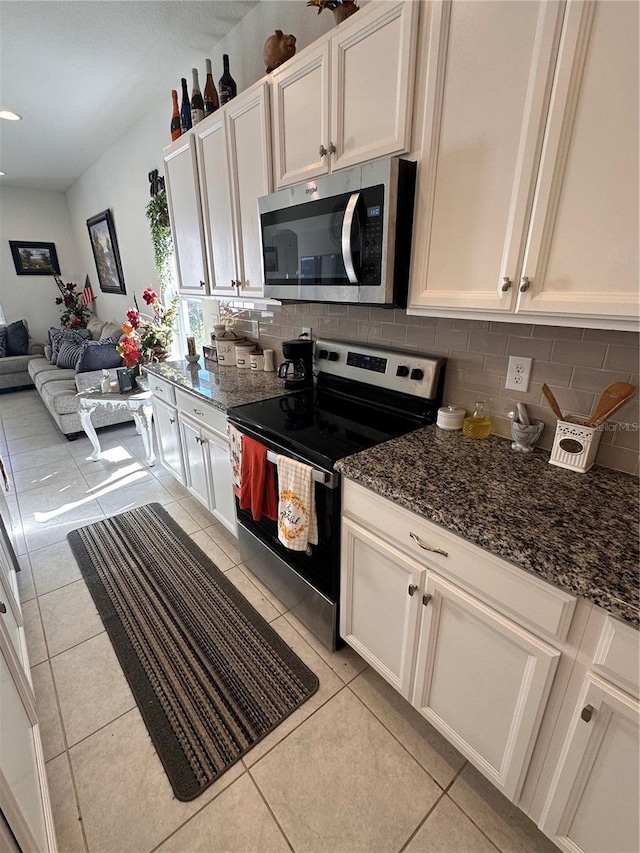 kitchen featuring white cabinetry, light tile patterned floors, and appliances with stainless steel finishes