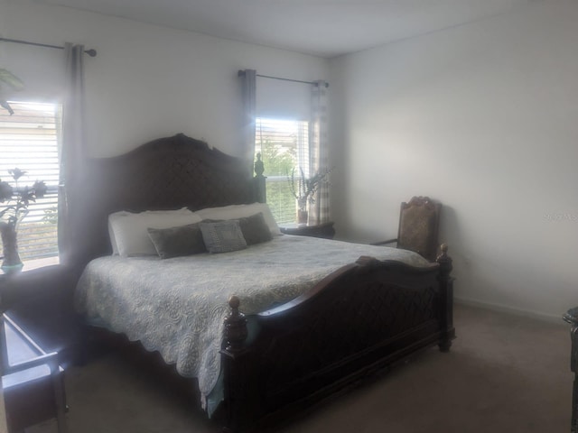 bedroom with dark colored carpet