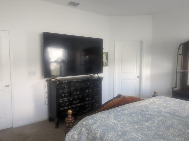 carpeted bedroom with visible vents