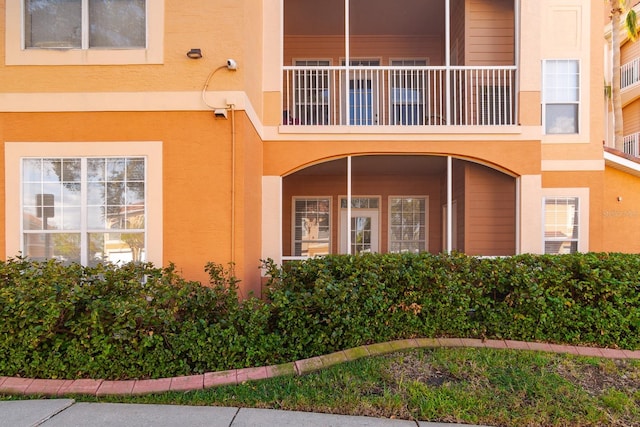 entrance to property with a balcony